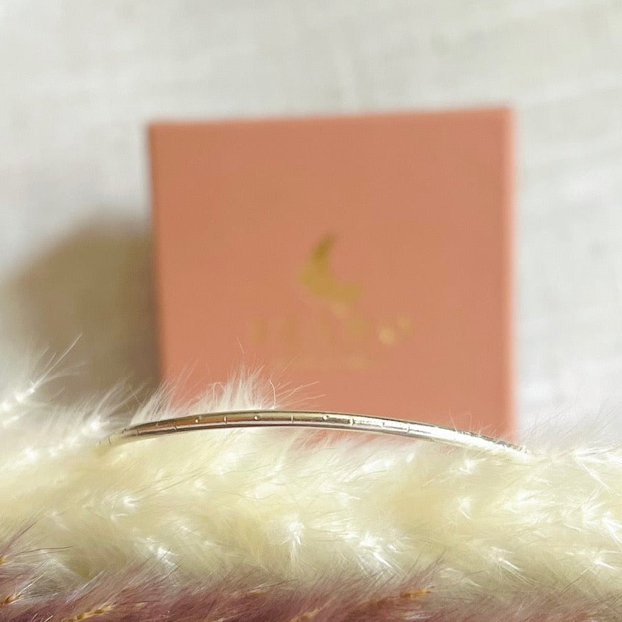 recycled silver bangle with little dot-line-dot detail but into the round wire.